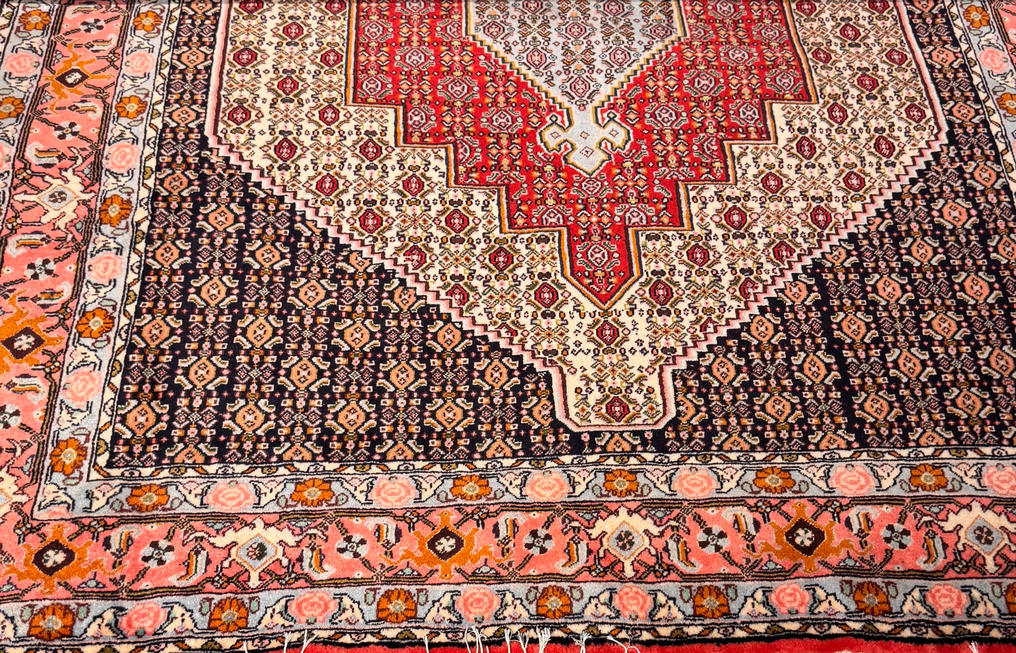 Close-up of a Senneh rug's Herati field and fine wool pile
